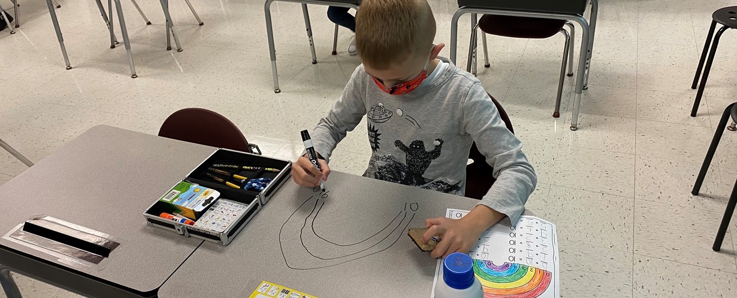 Student at Harrison working on Rainbow Math